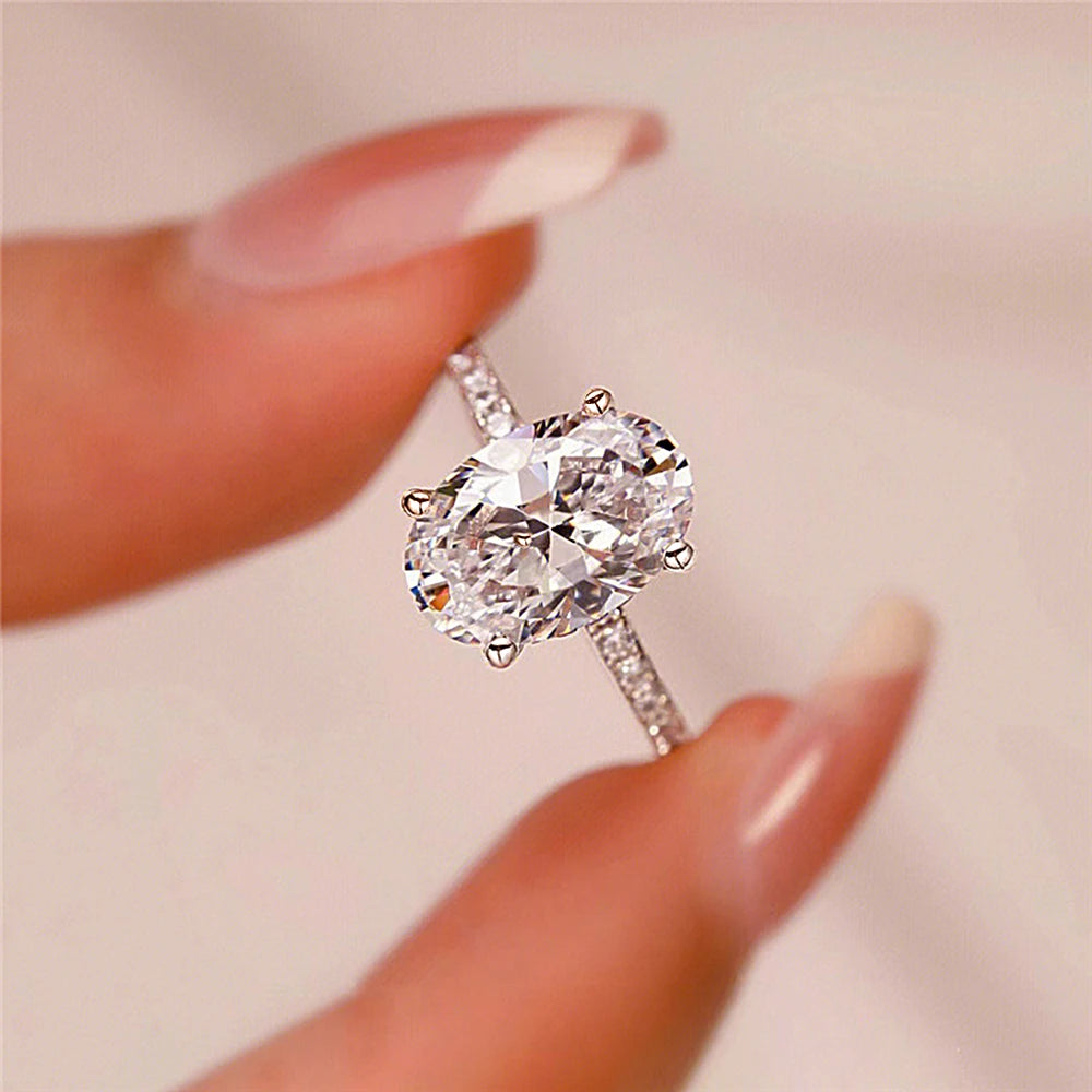 Anillos de compromiso de moissanita de corte ovalado completo